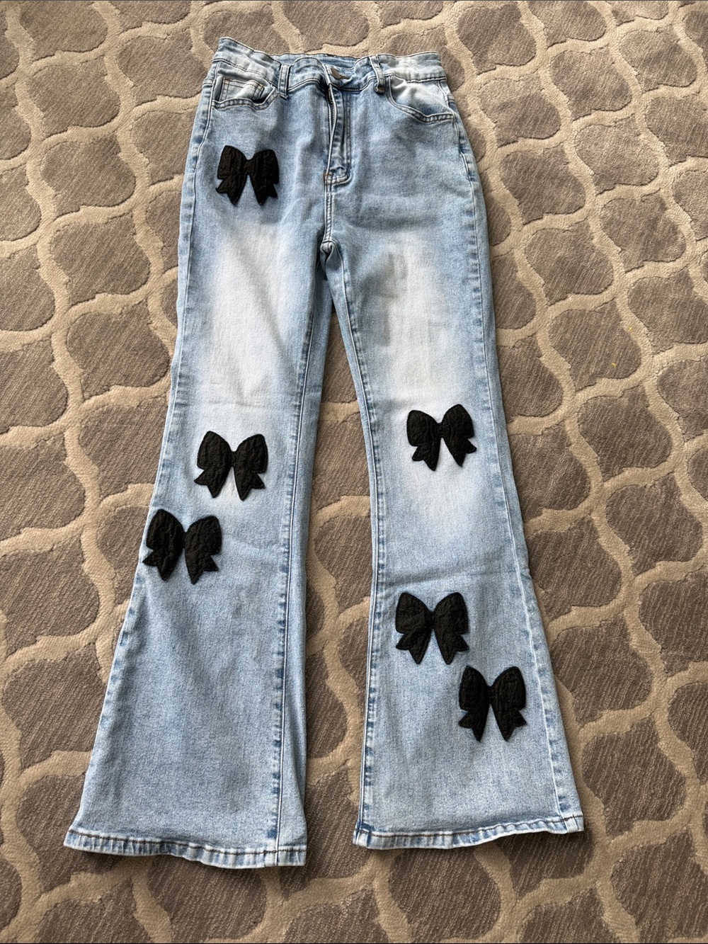 SHEIN Light Blue Flared Jeans with Black Bow Patches